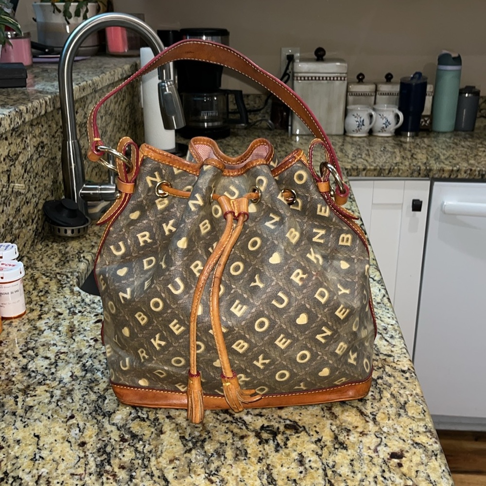 Dooney & Bourke Brown Monogram Drawstring Bucket Bag with Tan Trim